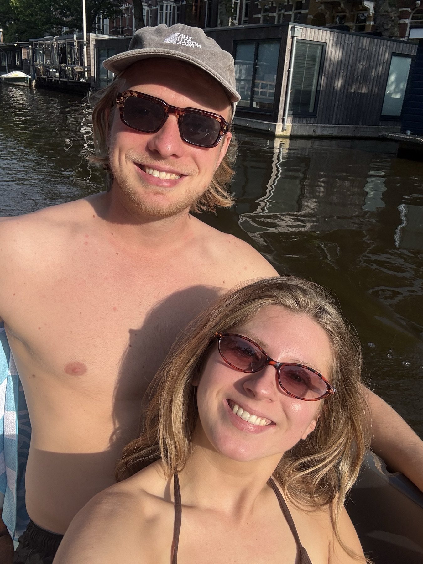 Leon and Tessa together by the water